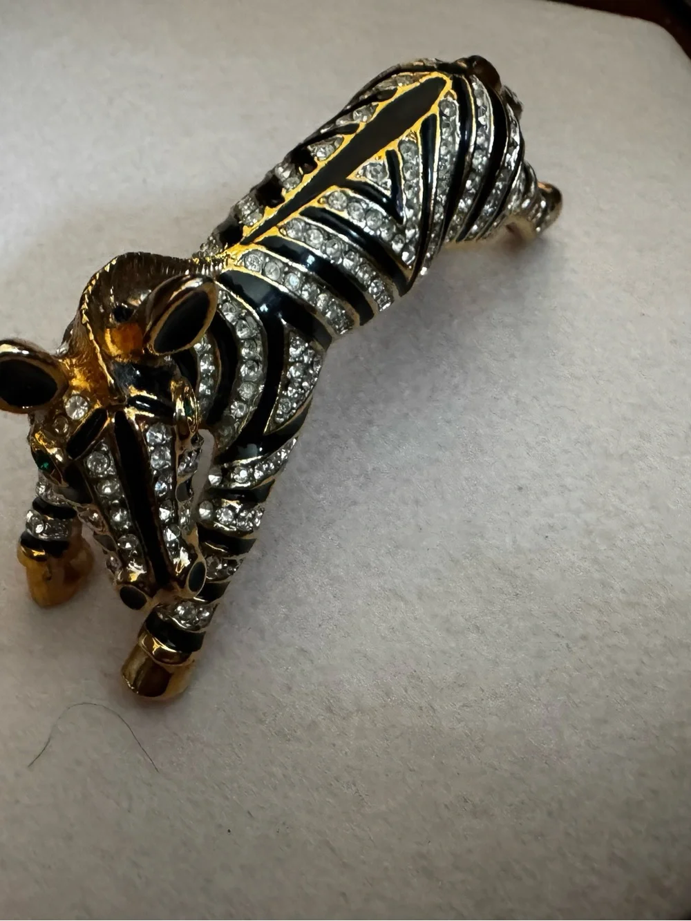 Vintage 1980s gold and black enamel over the shoulder brooch
